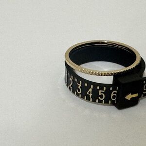 Gold toned ribbed ring​​​​